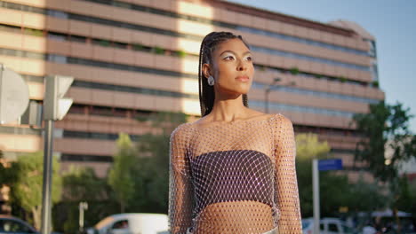 attractive fashionista looking camera busy street closeup. portrait girl posing