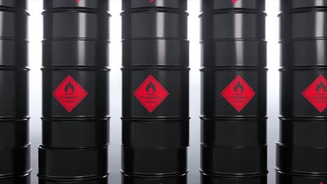 stacked black flammable liquid barrels