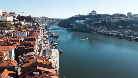 drone shot of european city porto with luis i bridge over douro river in portugal