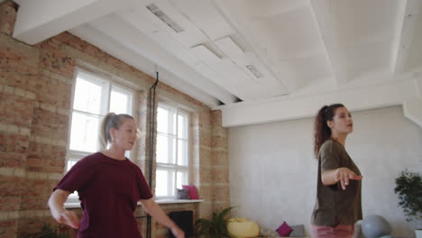 woman dancing with female teacher at private class