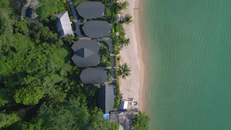 great aerial top view flight huts resort beach bungalows, jungle hilly island thailand 2022