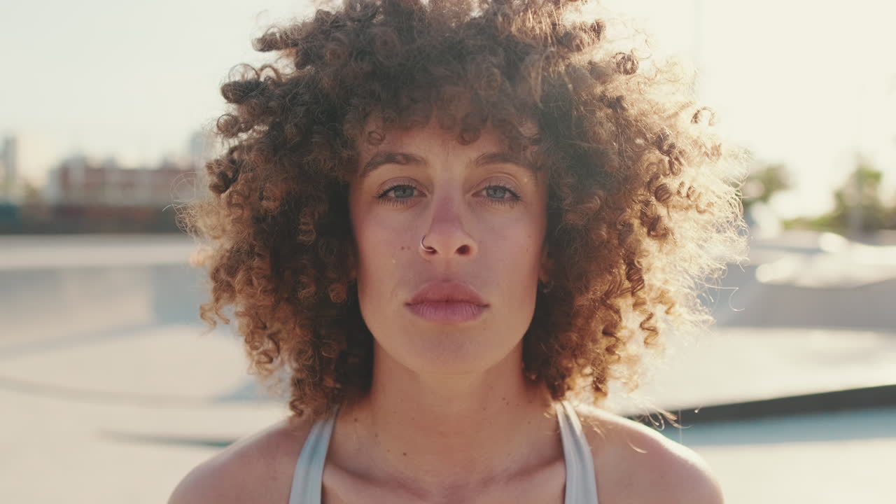 Portrait Of A Sporty Woman With Curly Hair