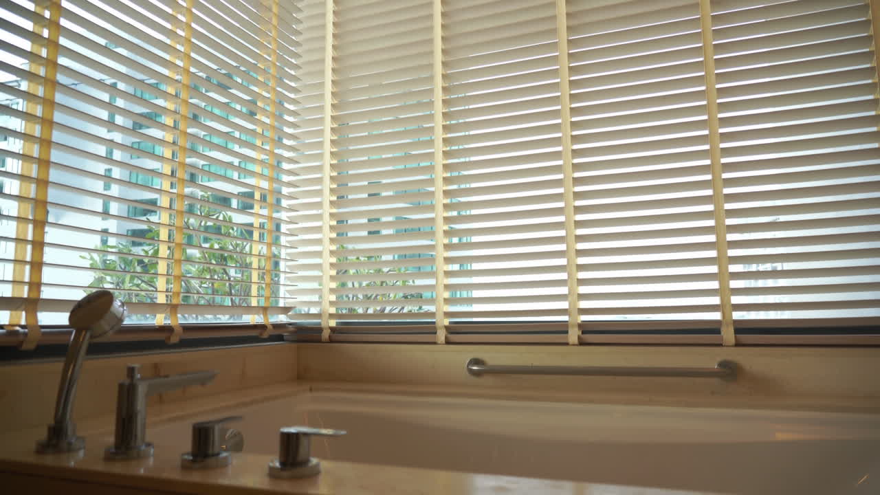 Tilt-down from the window blinds to a large soaker tub
