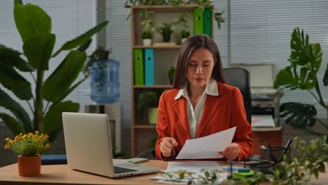 businesswoman working on documents in a modern office