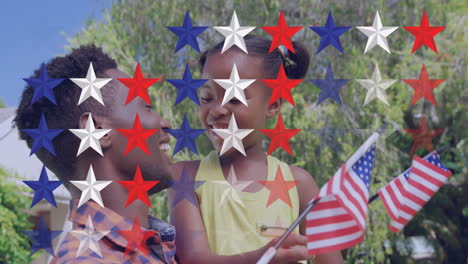 animation of stars over happy african american mother and daughter with usa flags