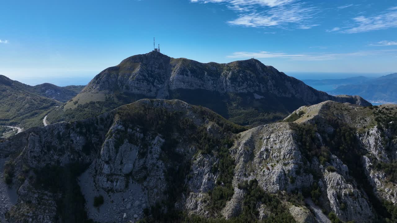 Aerial: Stirovnik mountain with blue sky during the day in Lovcen National Park, southwestern Montenegro, establishing drone shot