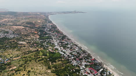 high angle aerial panoramic overview of mui ne beach and ham tien coastline, vietnam