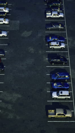 evening view of a parking lot filled with parked cars