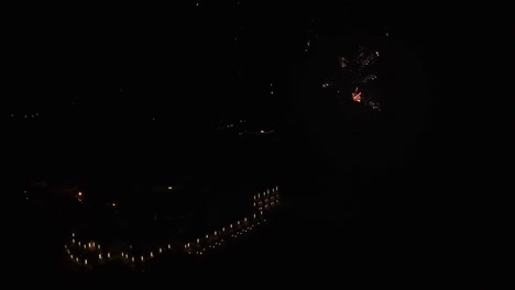 firework display in front of large hotel