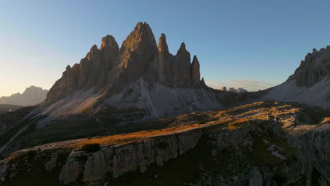 glowing sunrise south tyrol tre cime cliff edge mountain peaks terrain aerial view