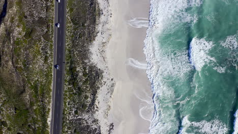 4k drone footage of cars driving on a road along