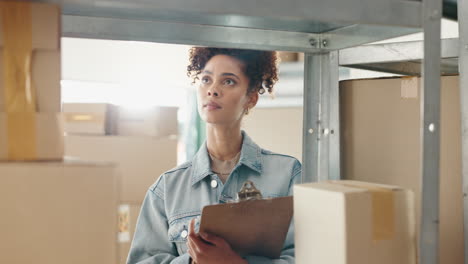 woman inspecting inventory in a warehouse