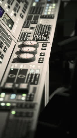 closeup of a control panel with gauges and buttons