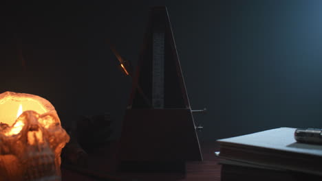 metronome set the rythm in the dark, old room