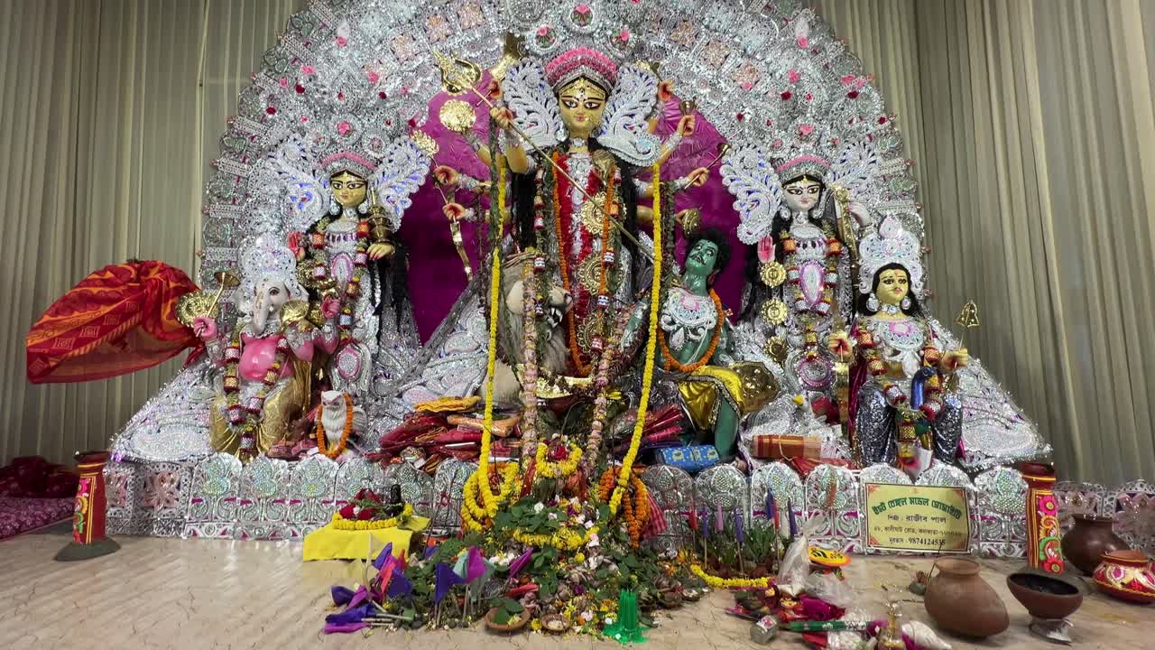 Profile view of Goddess Durga Idol decorated with jewellery and flowers during Durga Puja in Kolkata, India.
