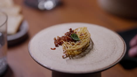 Close-up of a gourmet pasta dish on a plate