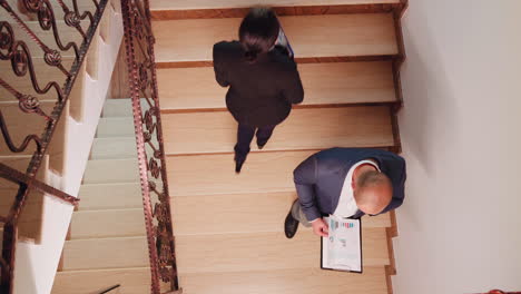 top view of stressed businessman speaking on smartphone