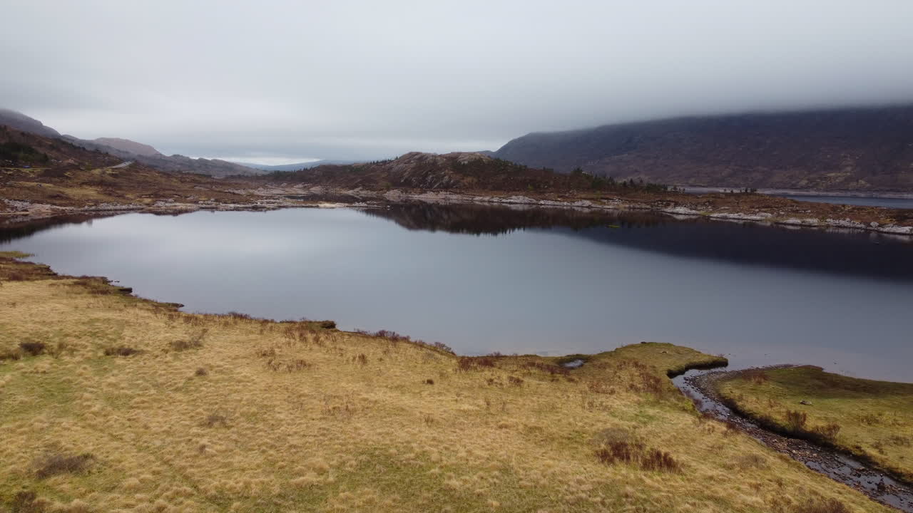 Aerial flight over majestic Loch Cluanie in Scotland highlands