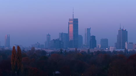 warsaw, poland, drone shot of varso tower and business center buildings at autumn sunrise