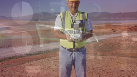 male surveyor operating drone controller in arid construction site, showing animated data graphs