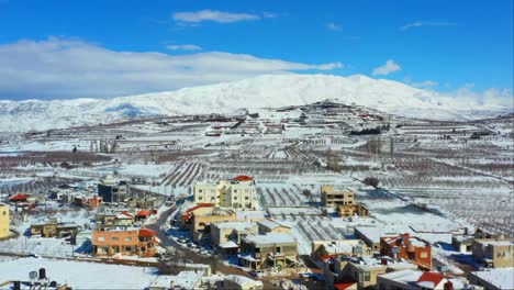 aerial-drone-shot-sunny-day-at-Ramat-Hagolan-city,-Buqata,-Israel