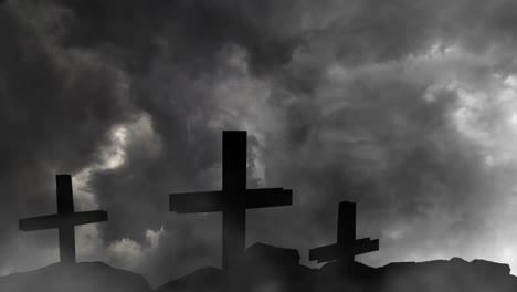 three silhouetted crosses on rock mound with thunderstorm background