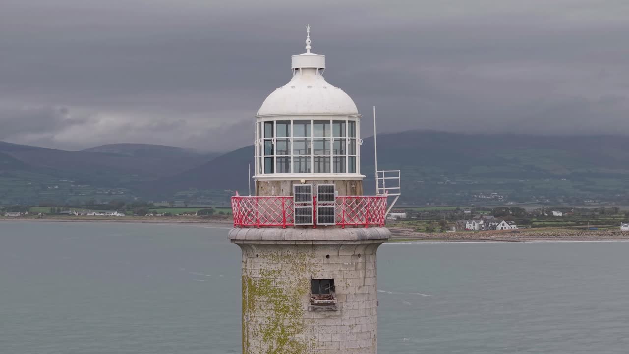 Haulbowline Lighthouse Against Overcast Sky In Carlingford Lough In County Down, Northern Ireland. Aerial Close-up Shot