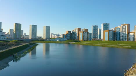 modern cityscape with lake and park