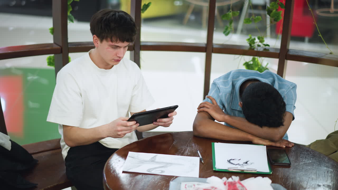 Moving camera captures intricate pencil and ink sketch on wooden table surface with scattered art supplies and dynamic hand movements showing creative process and close focus on geometric pattern soft lighting