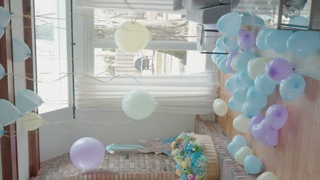 baby shower decoration with pastel ballons inflated with hydrogen