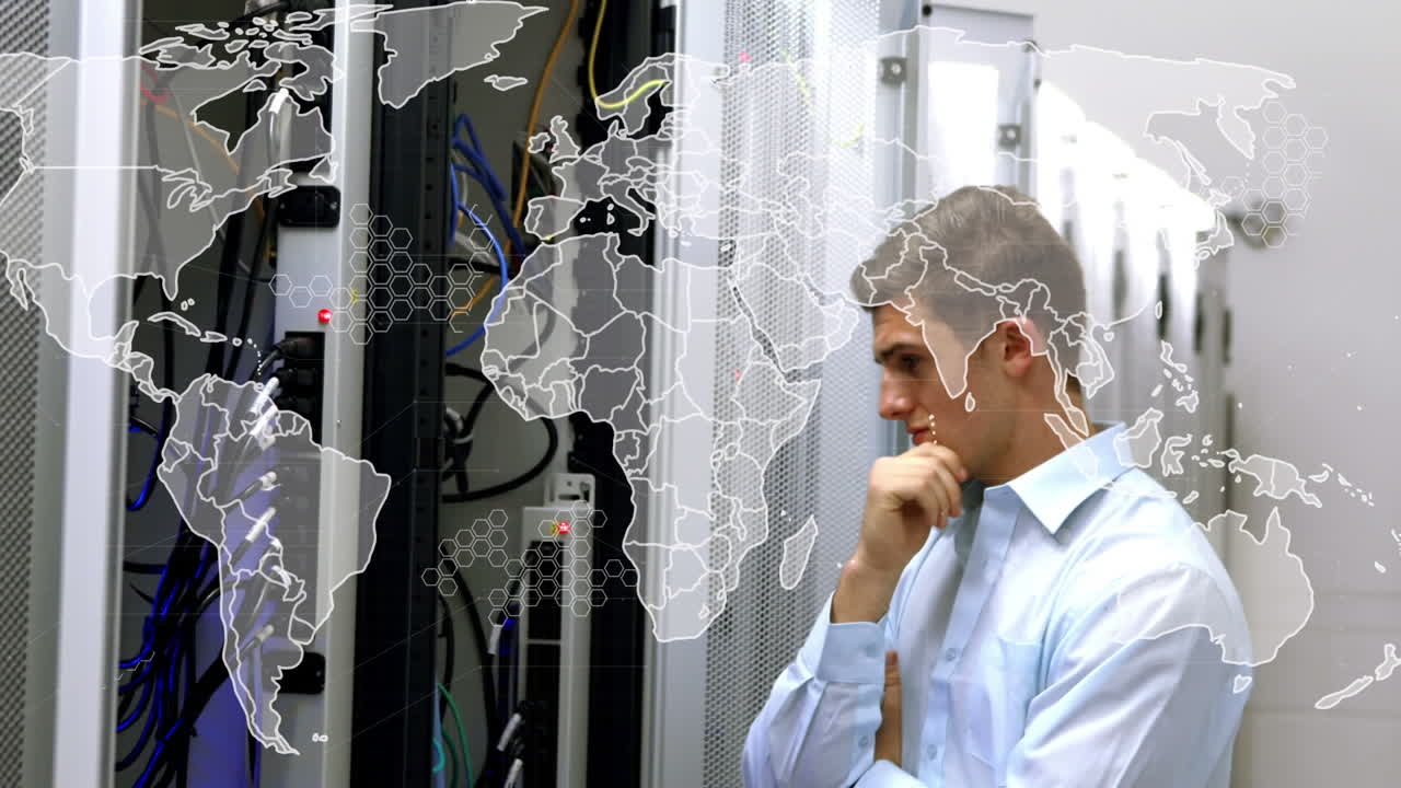 Animation of world map over caucasian businessman in server room