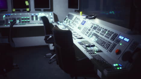 control room setup featuring advanced technology and dim lighting at night