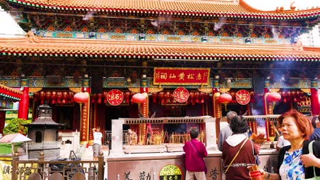 people engaging in rituals at a temple