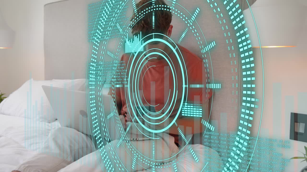 Man sitting on bed using laptop reaching for phone adjusting laptop teal tech HUD overlaying scene
