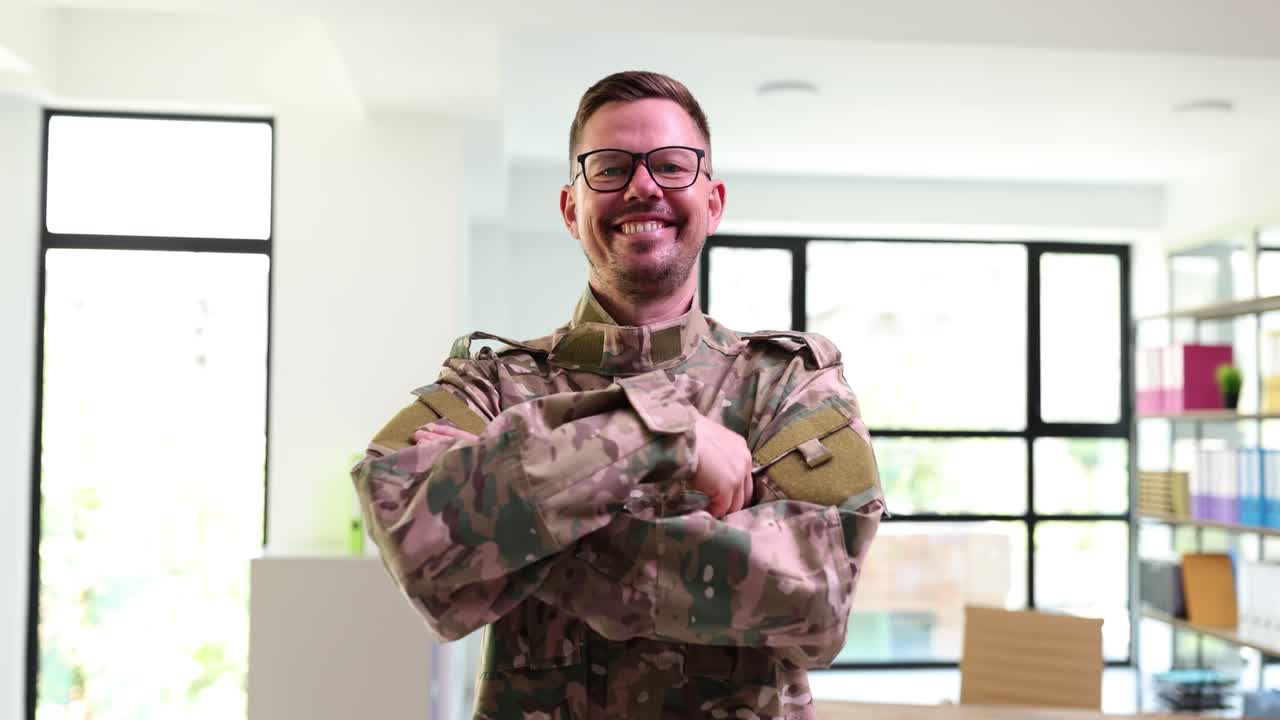 Smiling Man in Military Uniform with Crossed Arms