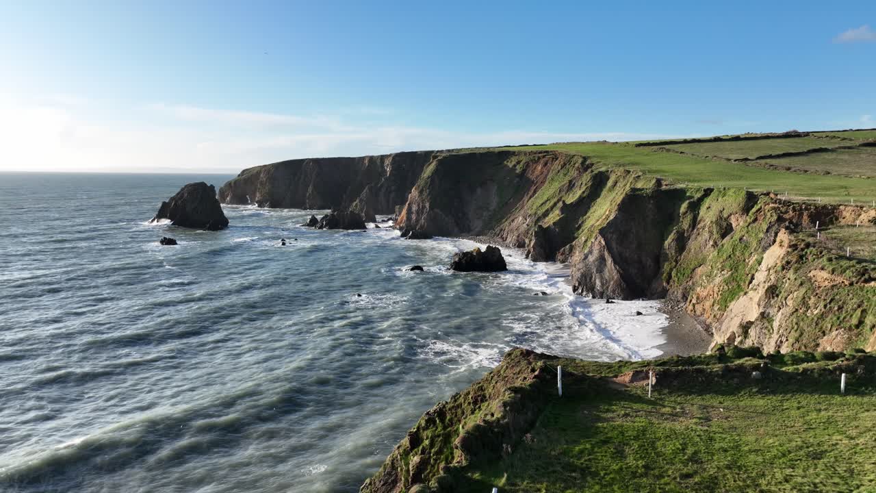 Epic Ireland Waterford drone view from above sea cliffs beginning of Atlantic storm