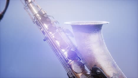 Golden-Tenor-Saxophone-on-blue-background-with-light