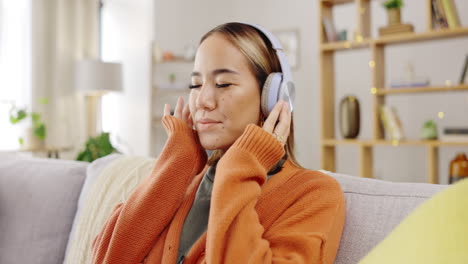 headphones, sofa and happy woman listening to