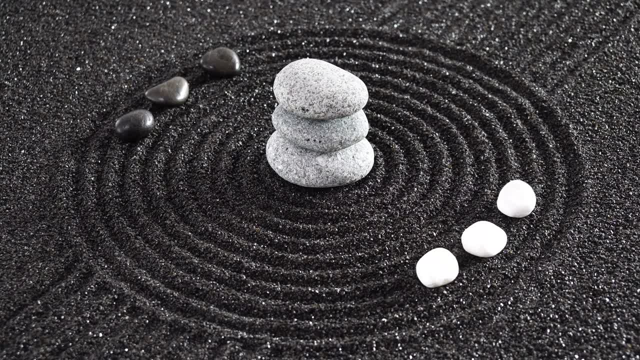 Japanese ZEN garden with yin yang stones in textured sand