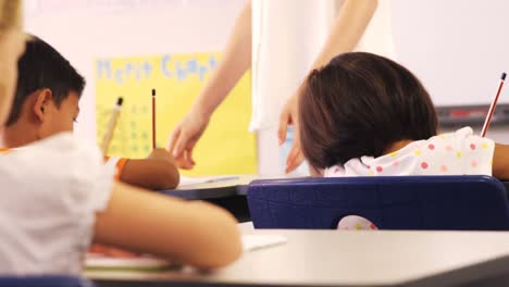 children are writing on the notebook