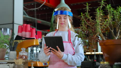 cafe worker using tablet