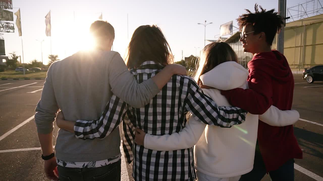 Muslim Young Worker Sitting On The Table While Talking With Businesswoman 1