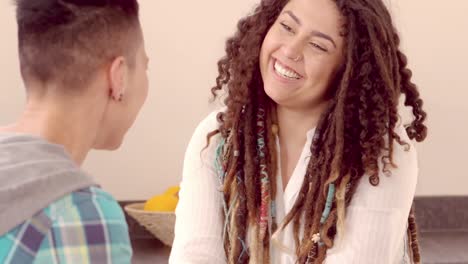 Happy-lesbian-couple-talking-and-holding-hands