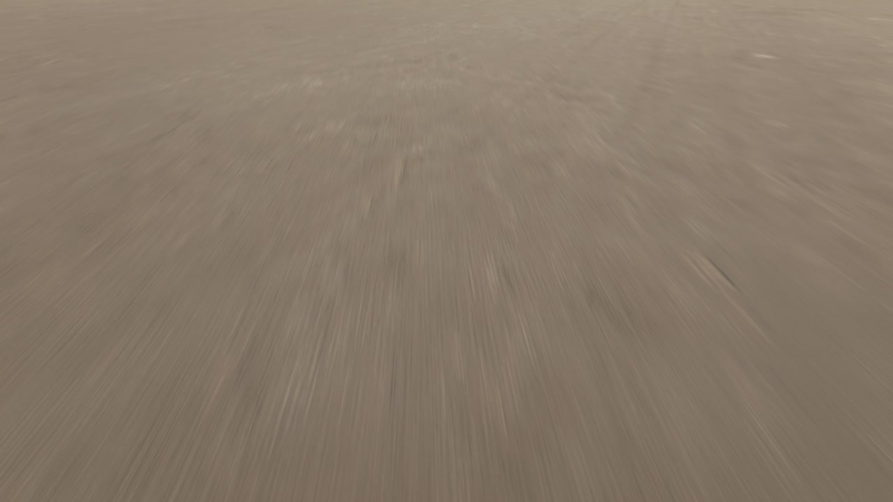 Aerial view of Bonneville Salt Flats expanse, showing vast, serene landscape