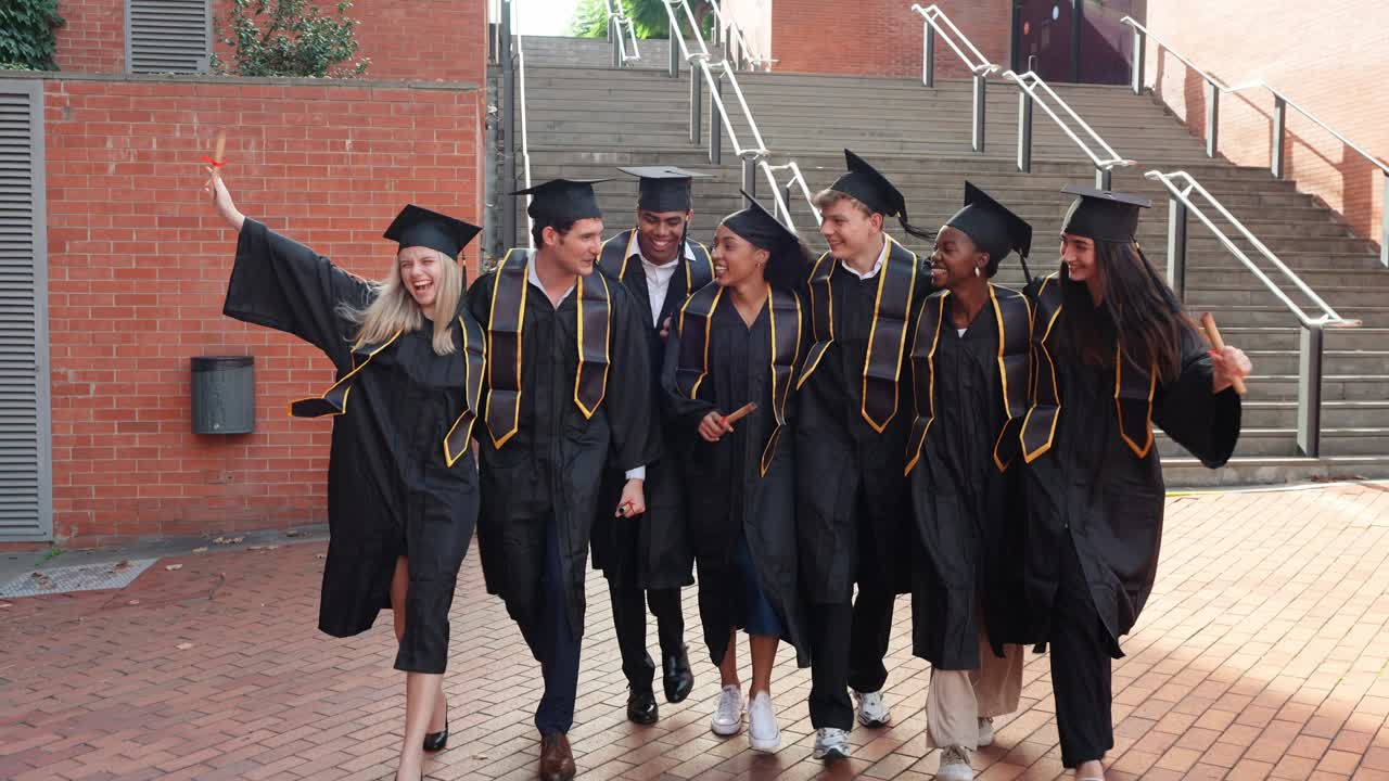 Happy Diverse Graduates Walking and Celebrating on University Campus