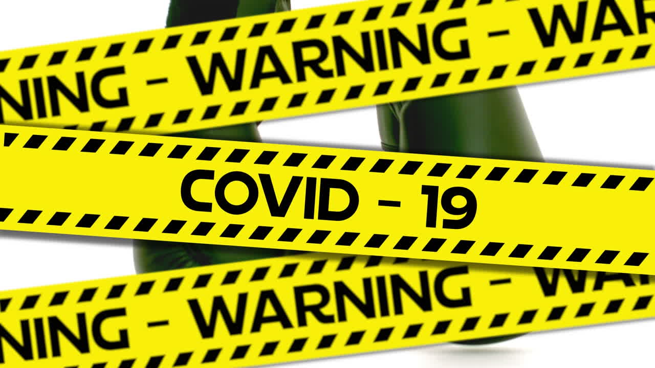 Words Warning Covid-19 written on yellow tape over boxing gloves in background