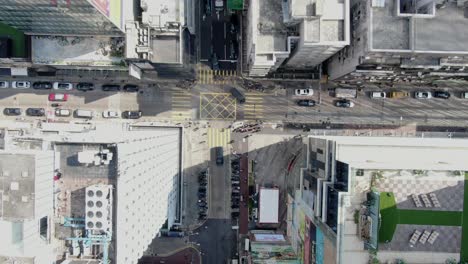 central hong kong, top down aerial view of traffic and city skyscrapers