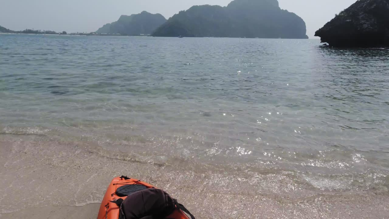 Preparing for an amazing kayak adventure over the clear waters of the Phi Phi Islands in Thailand - tilt up
