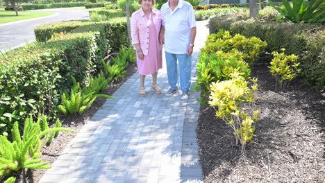 senior citizens approve of the landscaping in their luxury retirement community