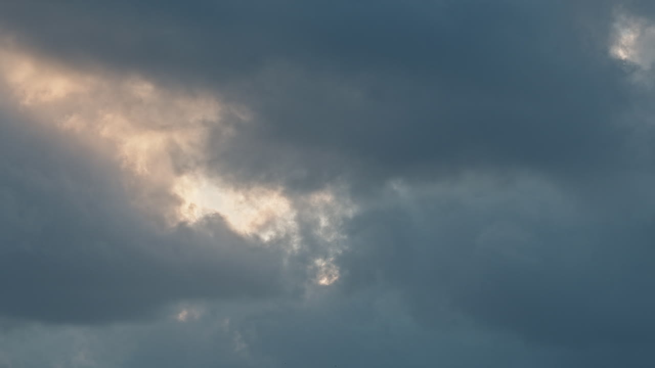 Clouds moving fast in sky, creating a serene and peaceful atmosphere